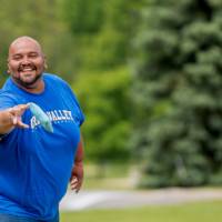 A player throws a bag and smiles during a game